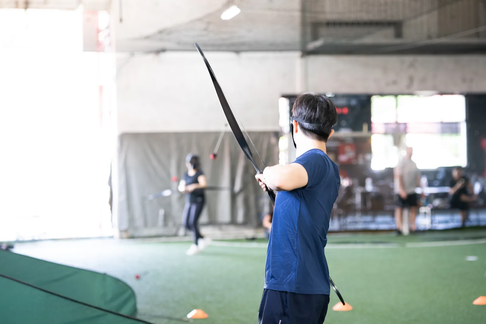 Archery Tag participants gathered for a Cohesion team building event
