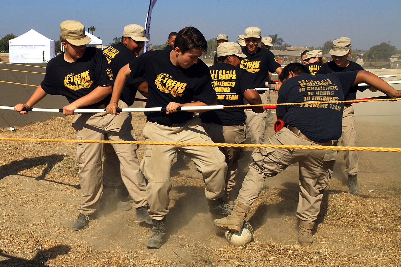 Human Foosball players coordinating inside the arena