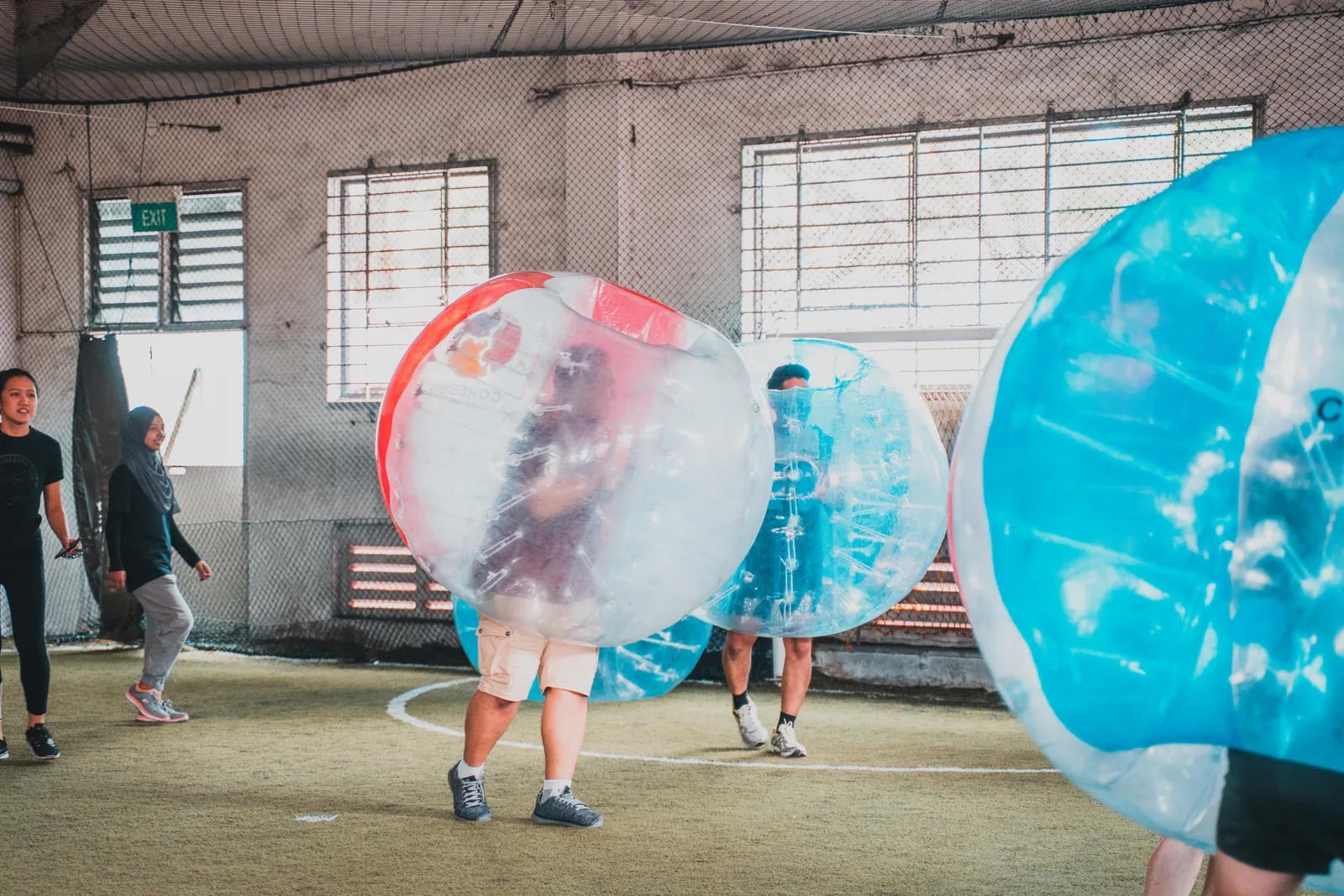 Bubble Soccer players competing during a Cohesion team building event