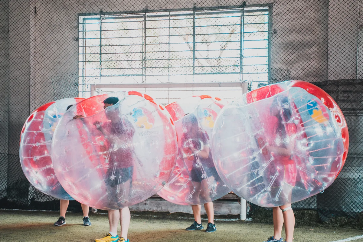 Bubble Soccer players lined up during a Cohesion team building activity