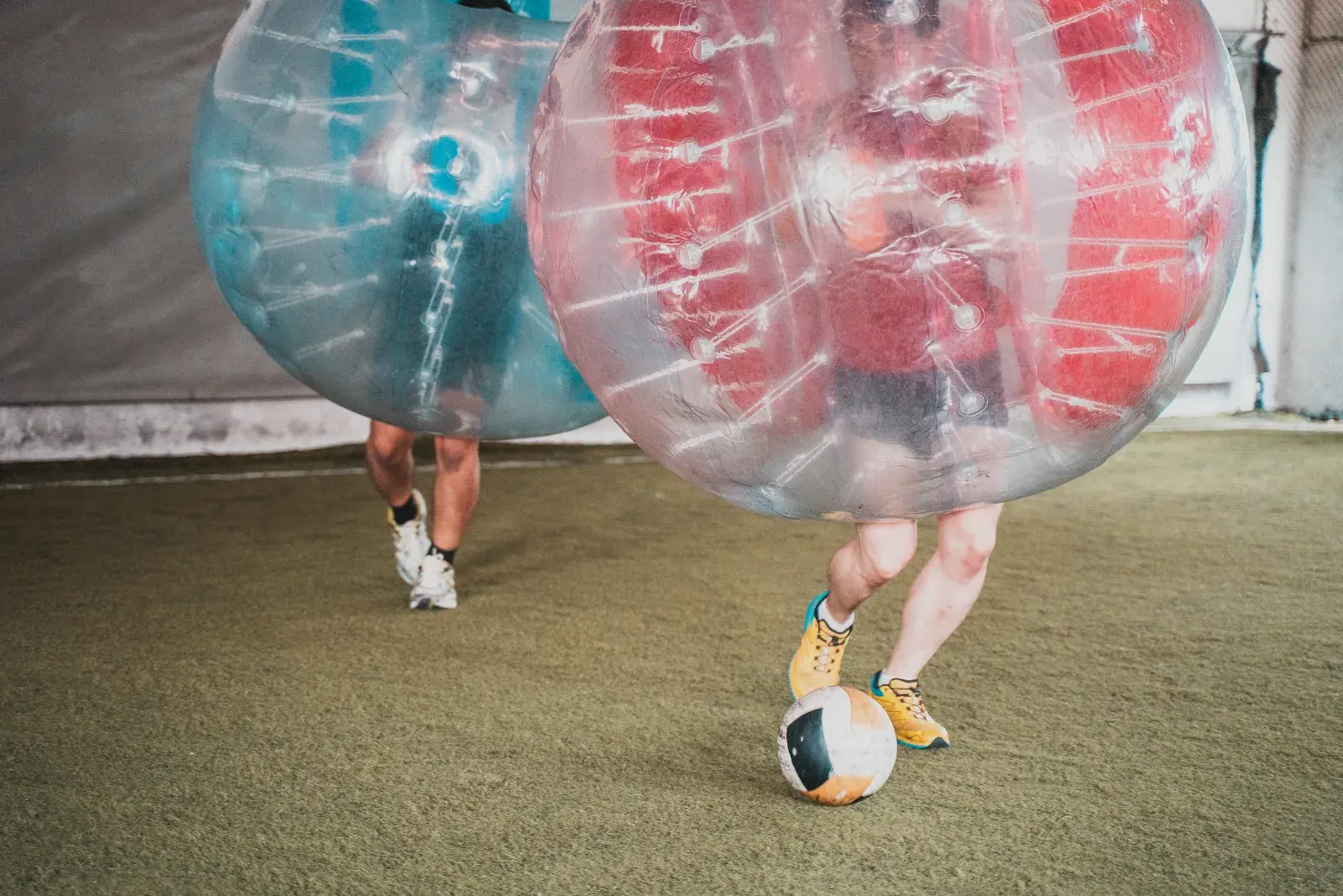 Bubble Soccer participants building momentum during a Cohesion team building activity