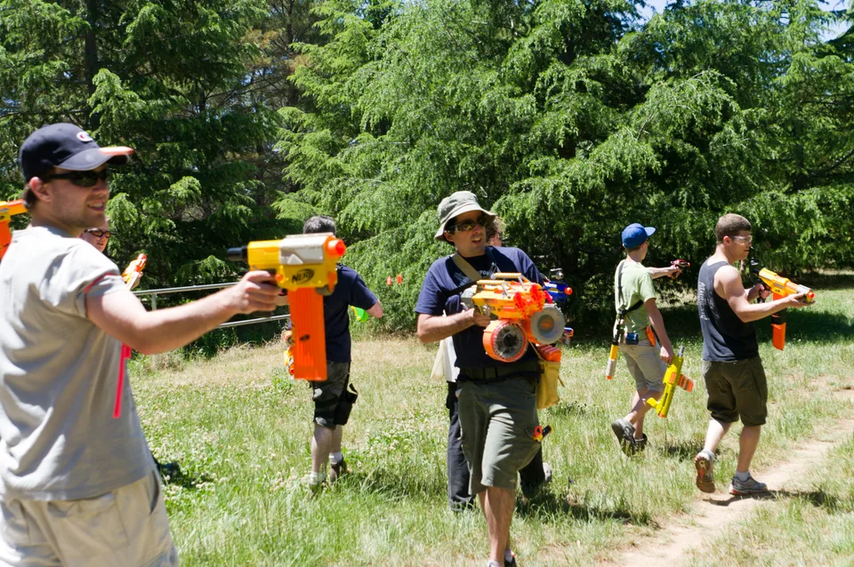 Reference photo of players taking part in an outdoor foam dart game