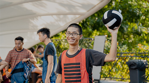 Bumball participant holding a ball during a team game