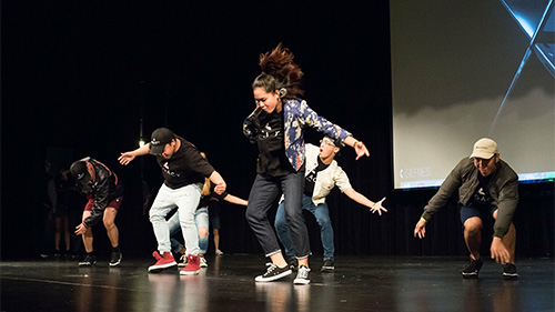 Participants dancing together on stage