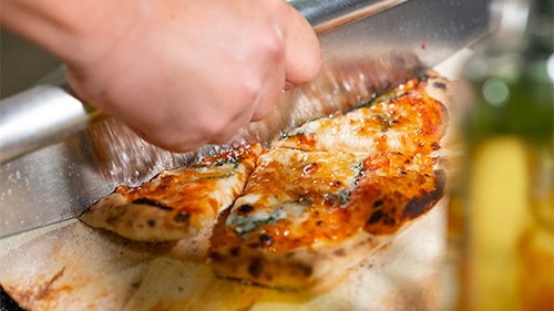 Pizza being prepared during a team activity