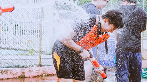 Splash Tag participant running through water spray
